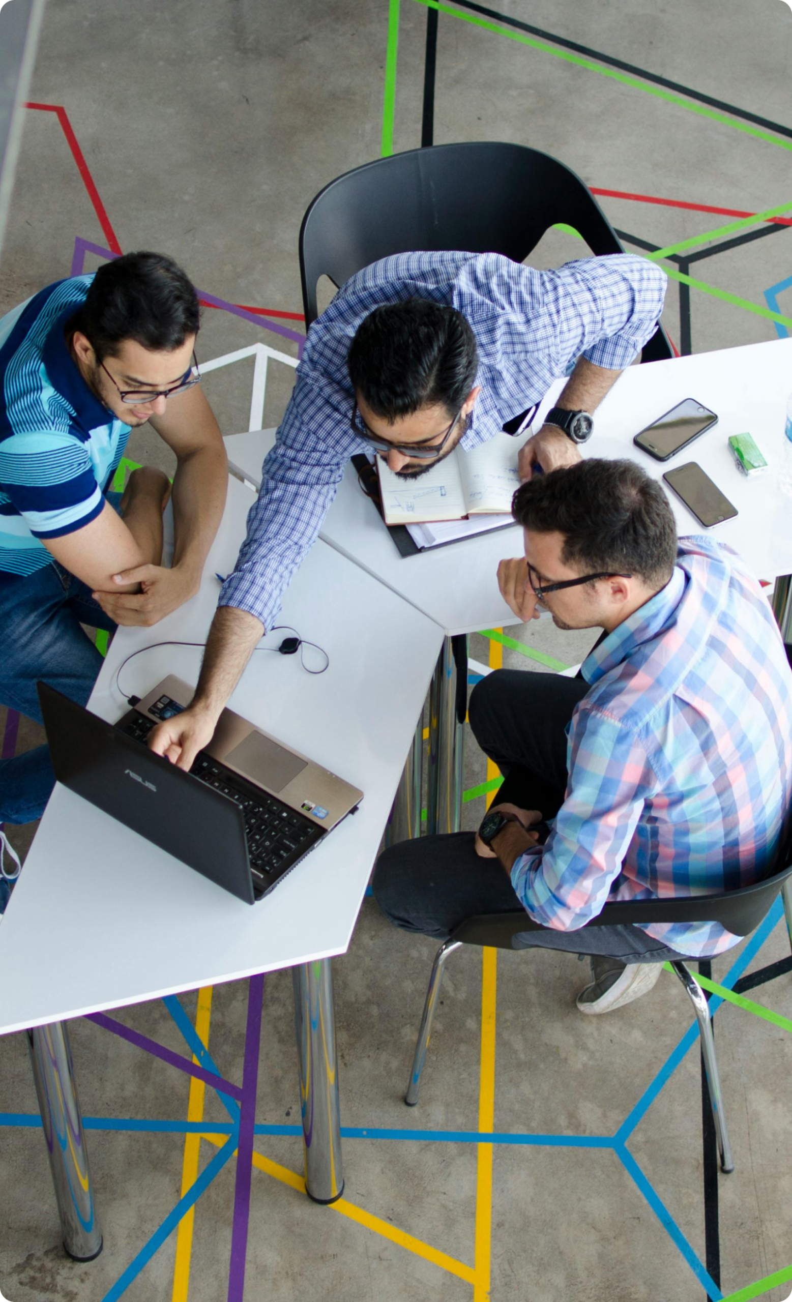 A group of people on a desk working together