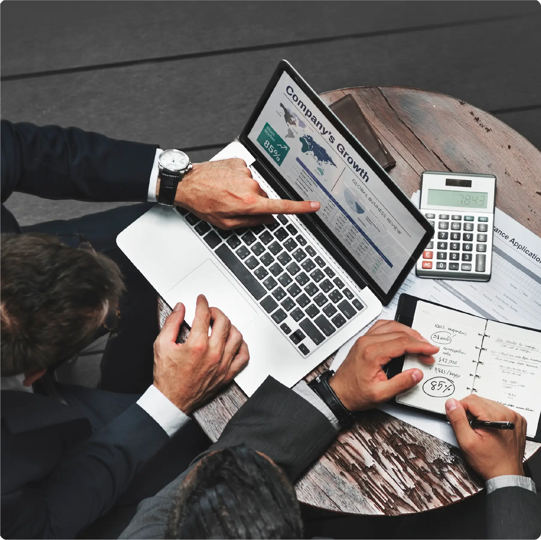 Two people working together to achieve company growth