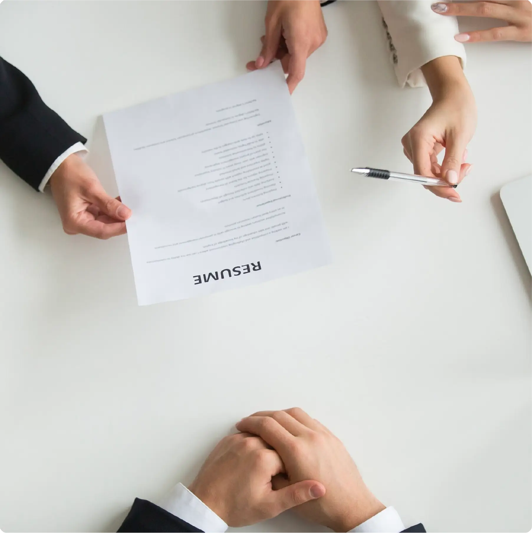 An image of employees talking about the resume